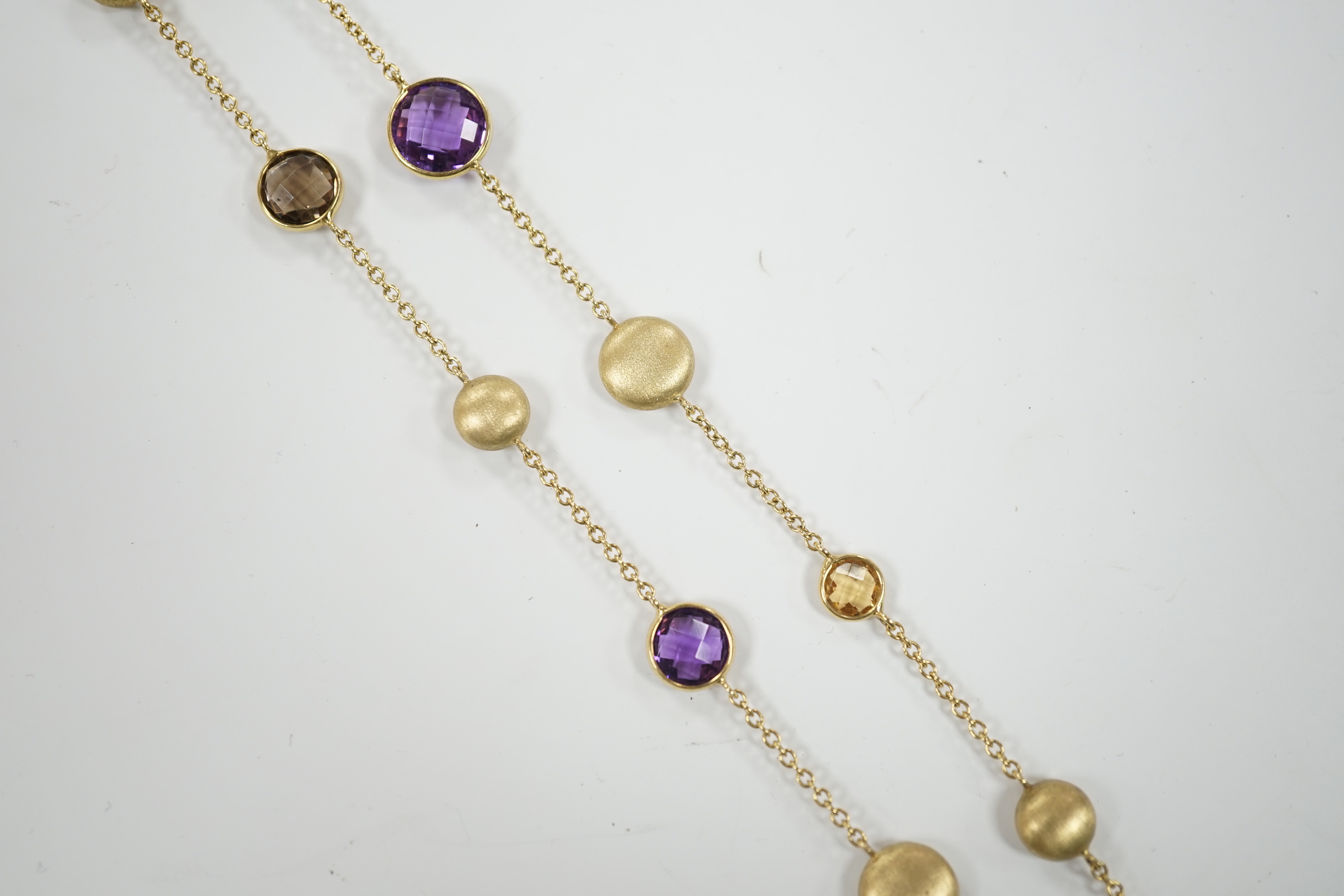 A modern Italian 9ct gold pebble and graduated multi gem set necklace, 68cm, gross weight 16 grams.